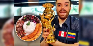 Ibai Llanos sosteniendo un trofeo dorado junto a un plato de comida tradicional y banderas de Perú y Venezuela